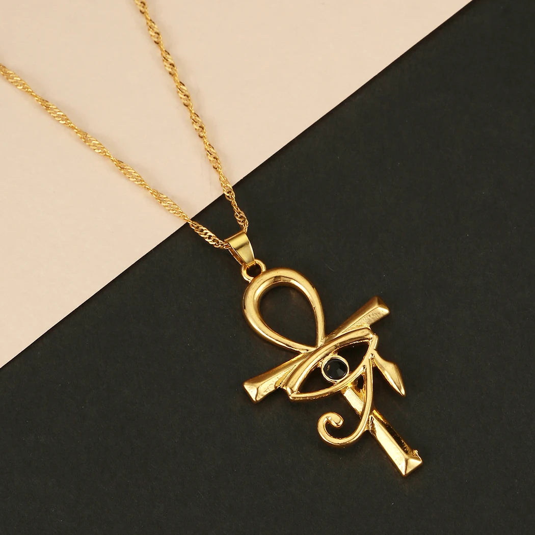 Golden Ankh & Eye Of Ra Necklace - Fusion of powerful Egyptian symbols in a stunning necklace.