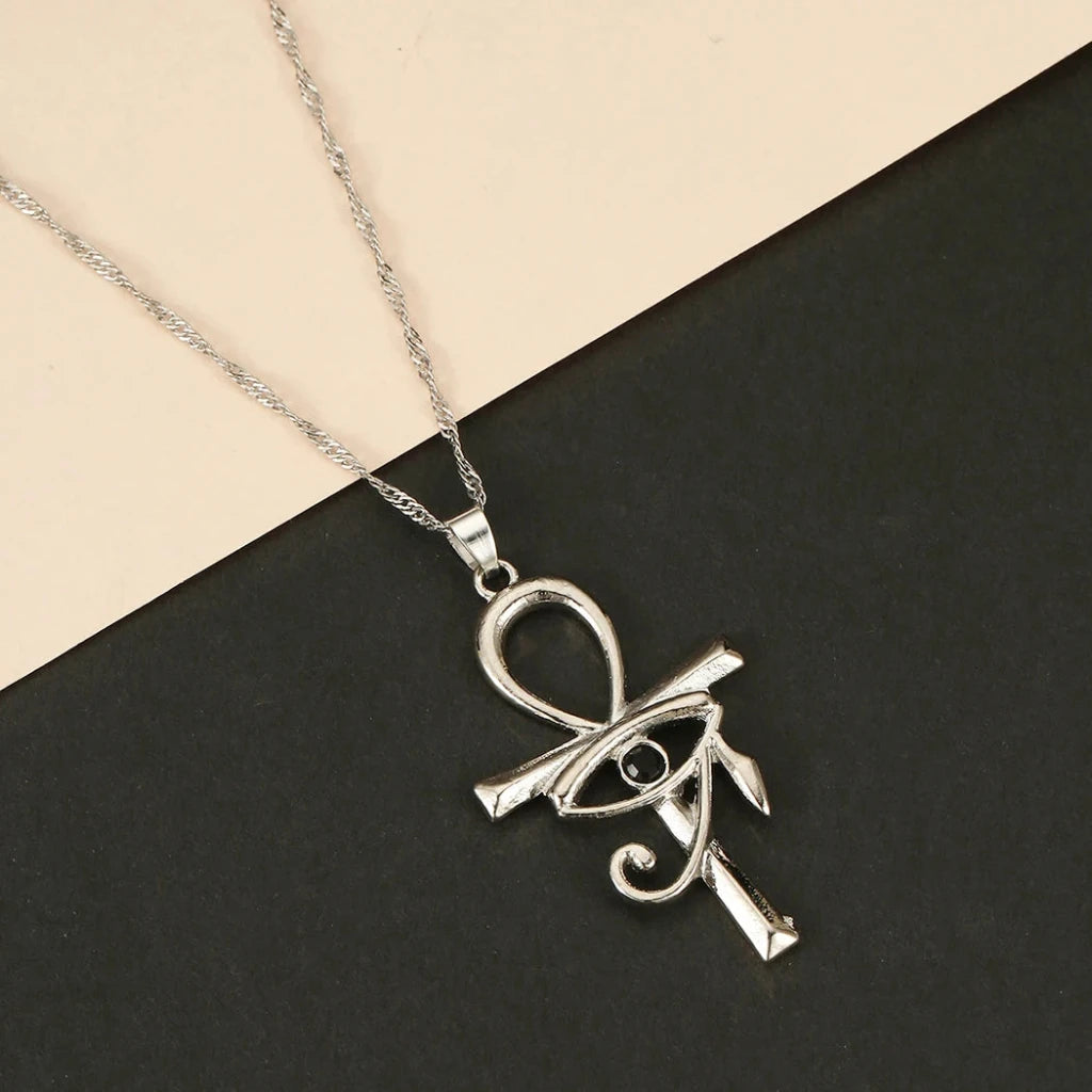 Silver Egyptian Ankh & Eye Of Ra Necklace - Symbol of life and power in a striking design.