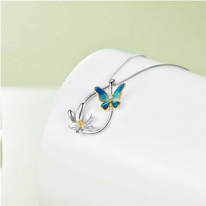 Silver Tear Drop-Shaped Daffodil & Blue Butterfly Pendant