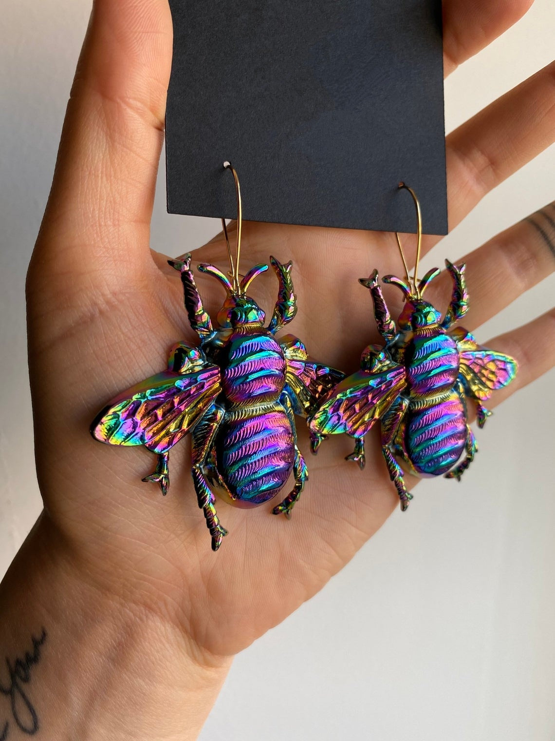 Psychedelic insect earrings glossy too